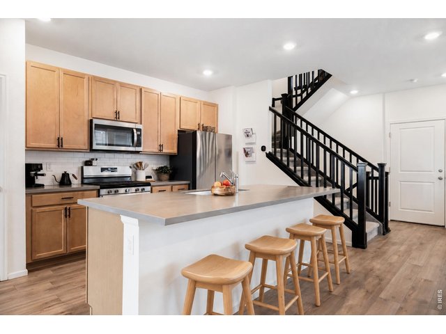 Property Photo 7 Fully equipped kitchen. **Image virtually staged.