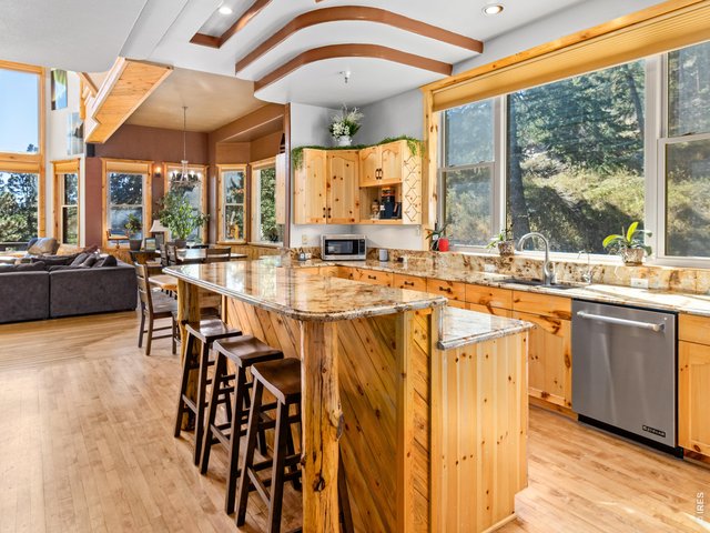 Property Photo 13 Large picture windows provide natural light and views