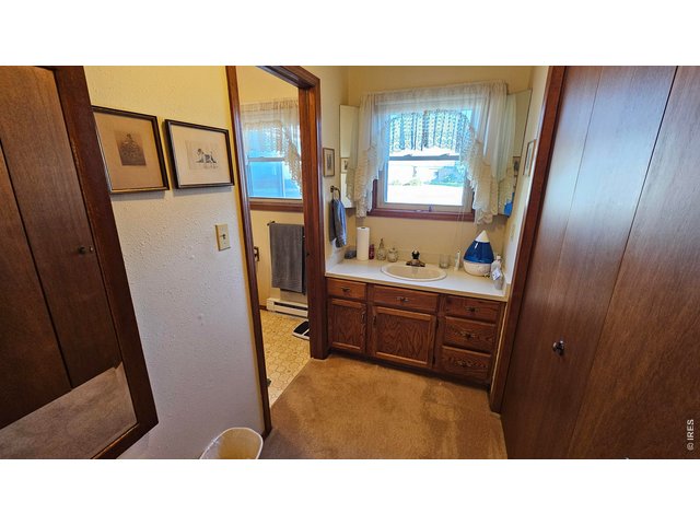 Property Photo 22 Primary Bathroom vanity open to bedroom
