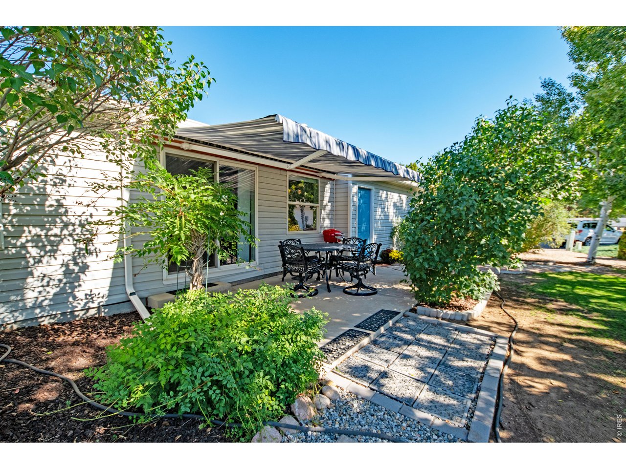 Property Photo 24 Comfortable patio with awning shade cover