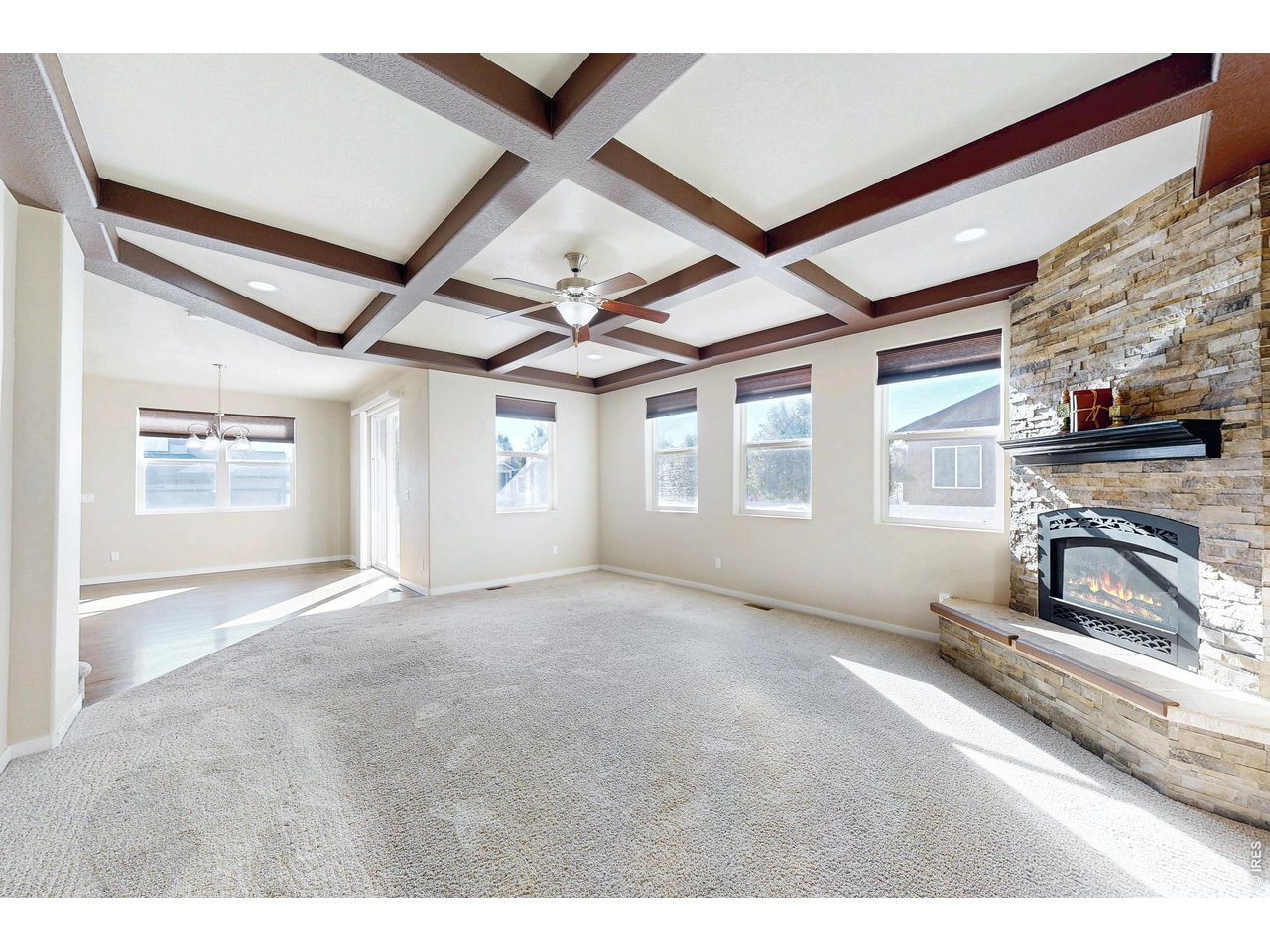 Property Photo 13 Gas fireplace w/ stacked stone and mantle
