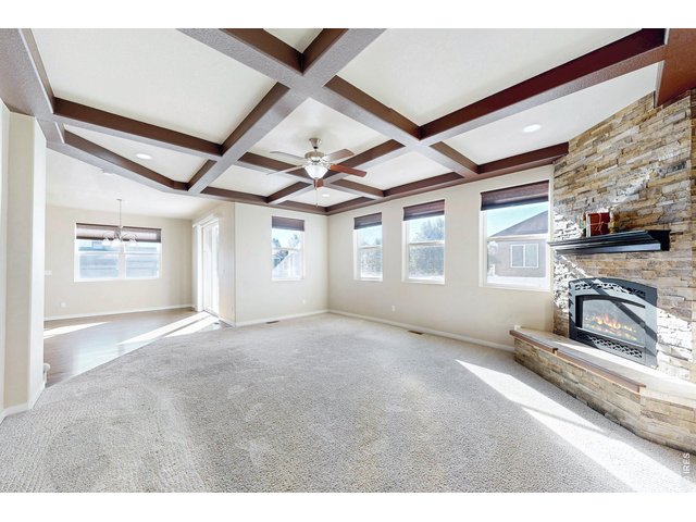 Property Photo 13 Gas fireplace w/ stacked stone and mantle
