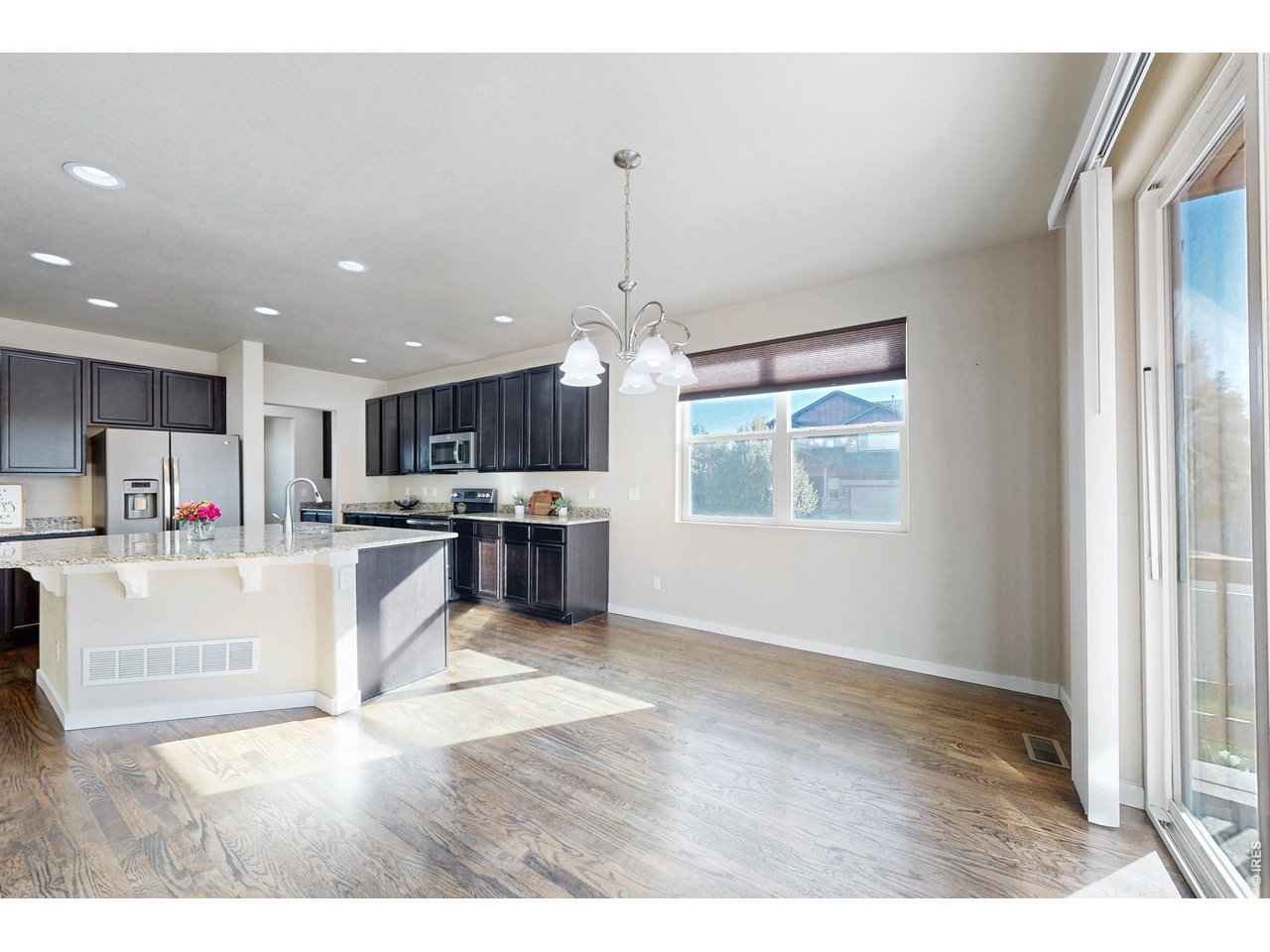 Property Photo 8 Eat-in kitchen next to back stamped patio