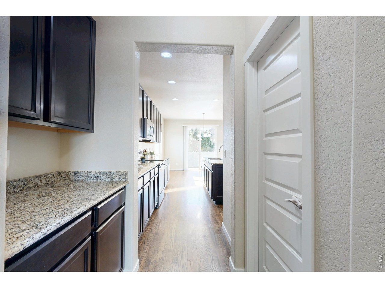 Property Photo 10 Walk-through to pantry and butler's pantry area leading to formal dining
