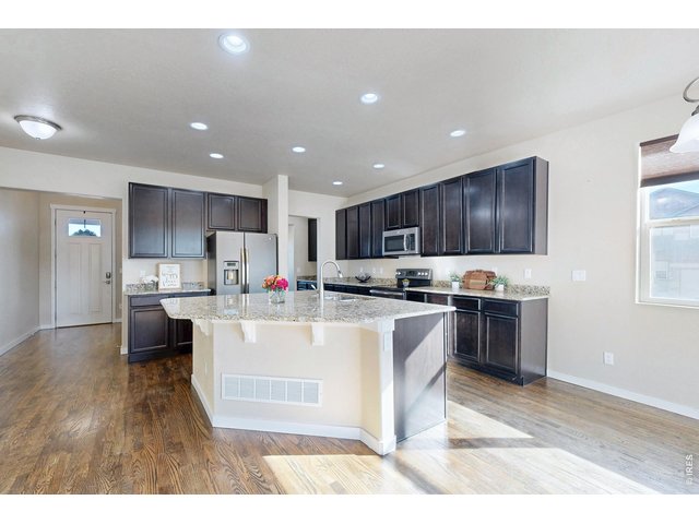 Property Photo 6 Dark wood cabinets, all stainless stell appliances
