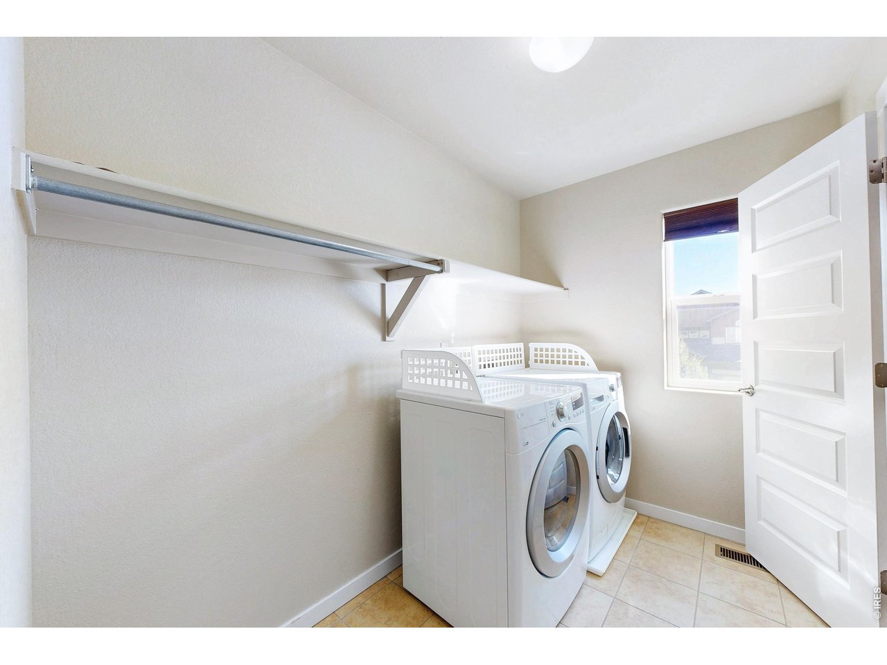 Property Photo 26 Upstairs laundry opens to both the hall and master closet!