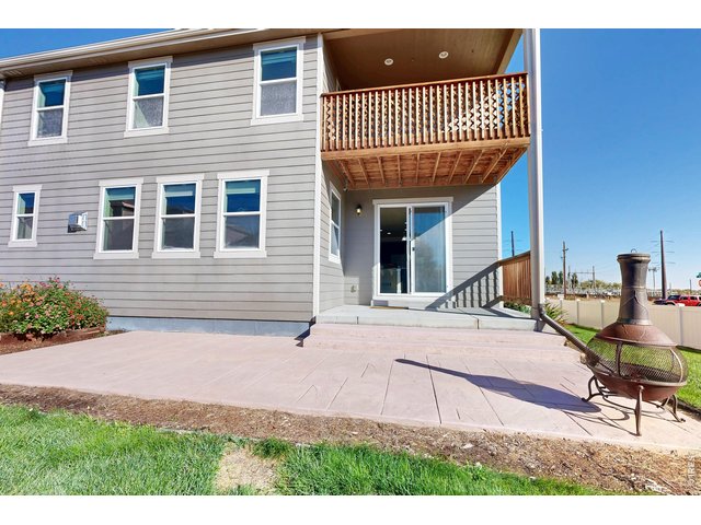Property Photo 43 Stamped back patio and balcony overlook from master bedroom
