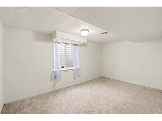 Property Photo 19 Basement bedroom with a closet