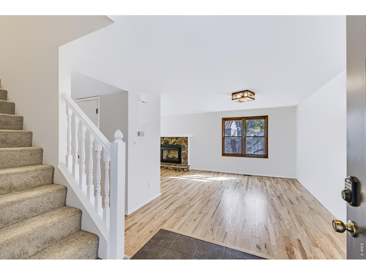 Property Photo 7 Entryway. Newly refinished Hardwood Floor.