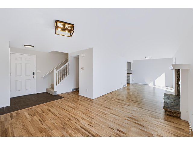 Property Photo 5 Living Room. Newly refinished Hardwood Floor. Open floor plan.