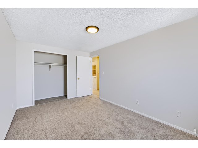 Property Photo 26 Spacious Bedroom 2. New carpet and paint.