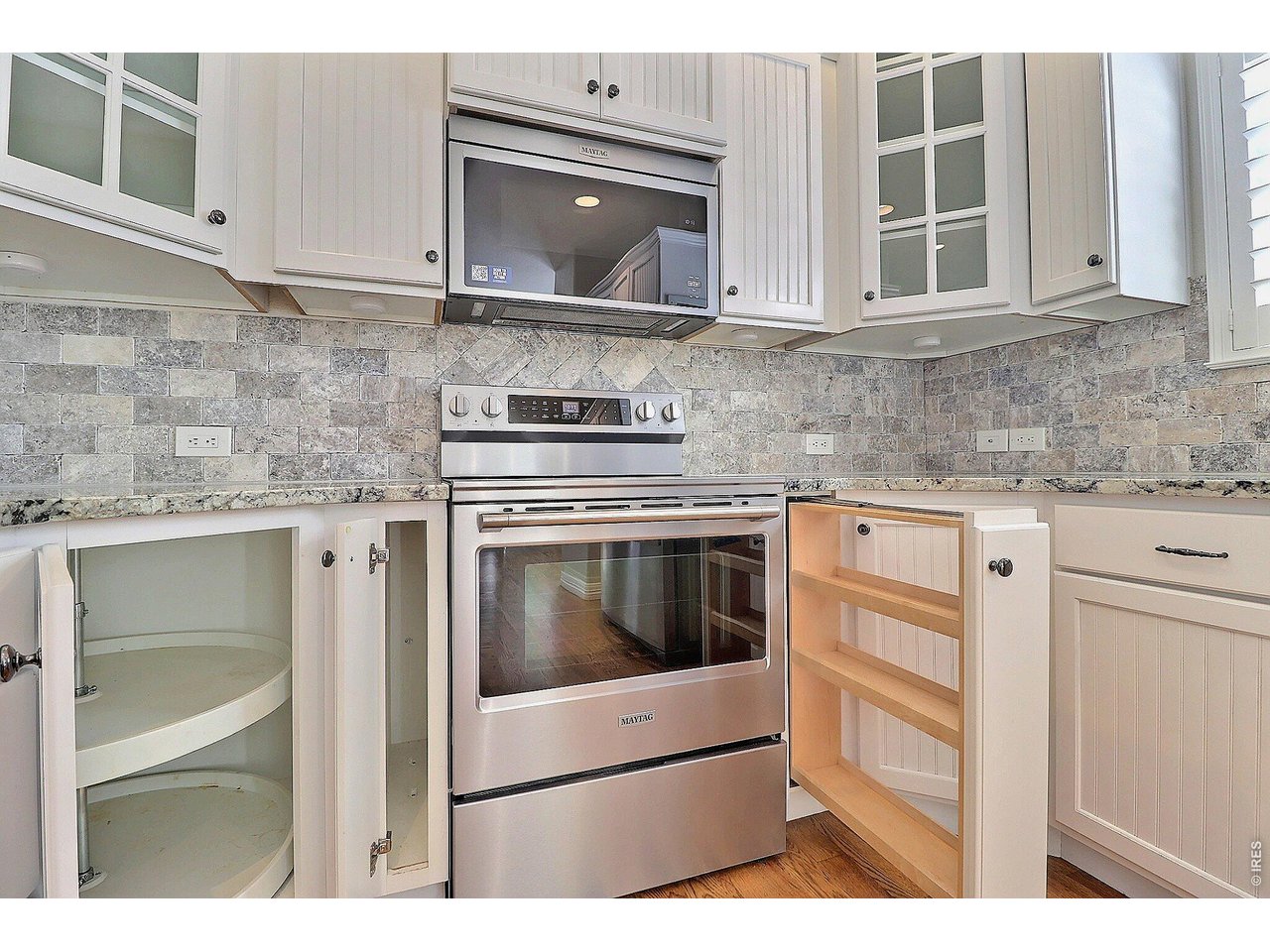 Property Photo 12 There are 2 Corner Turn Tables Plus a Pull-Out Spice Rack and a Place for Your Cookie Sheets