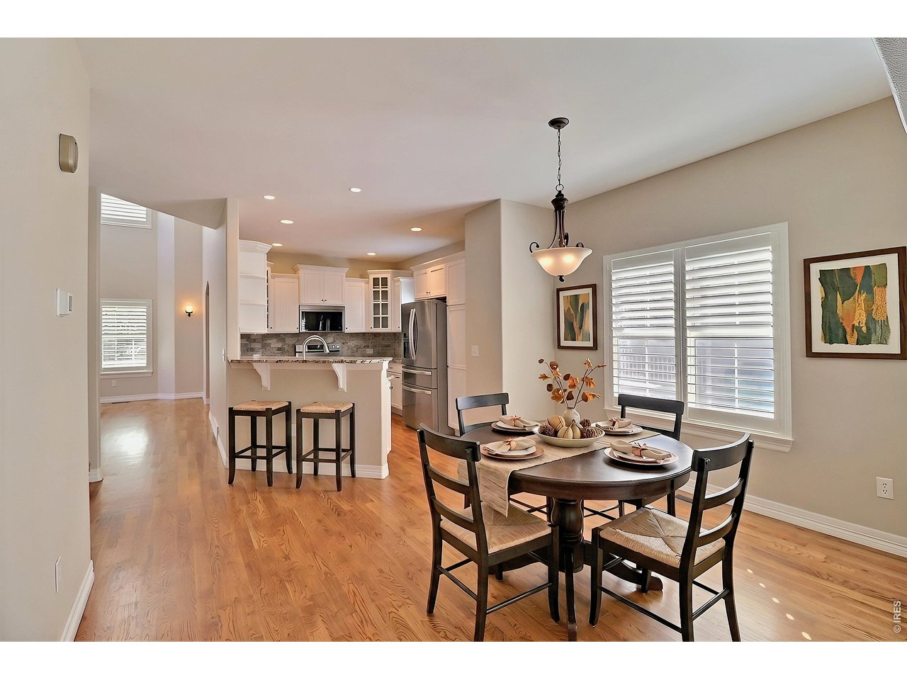 Property Photo 15 Staged Dining Room and Kitchen Breakfast Bar