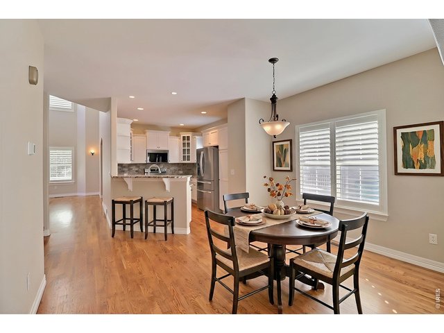 Property Photo 15 Staged Dining Room and Kitchen Breakfast Bar