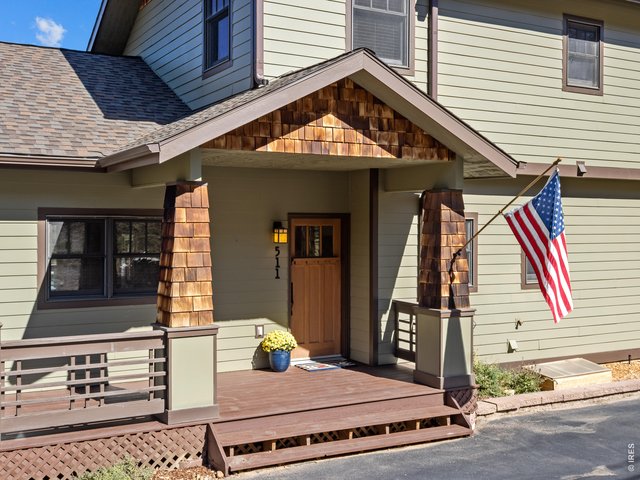 Property Photo 3 Covered front porch is a warm welcome