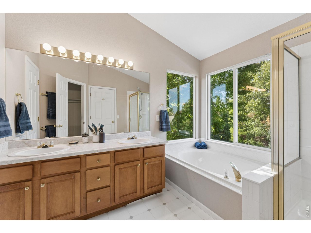 Property Photo 21 Deluxe Primary Bath with Dramatic Window Wrapping and Double Sink