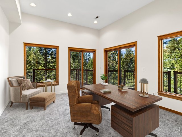 Property Photo 34 Lower level den/office with deck access and great light, virtually staged