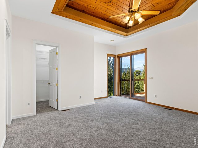 Property Photo 23 Primary suite with deck access and walk-in closet