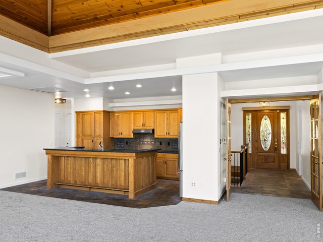 Property Photo 14 Kitchen is open to the dining and living area. Recently updated with new stainless steel appliances.