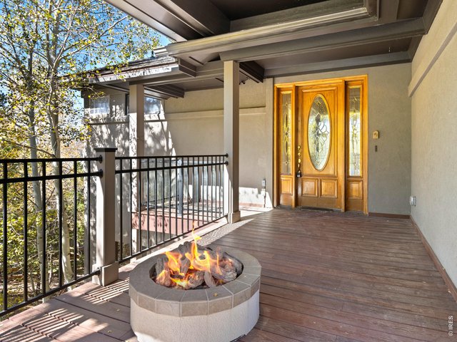 Property Photo 2 Gas fire pit on covered deck provides a warm welcome and relaxing space for every season
