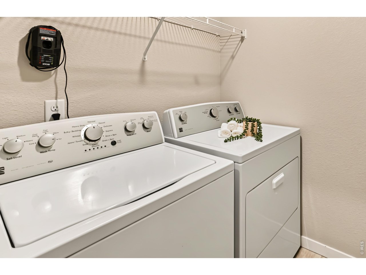 Property Photo 18 Separate laundry room with shelving