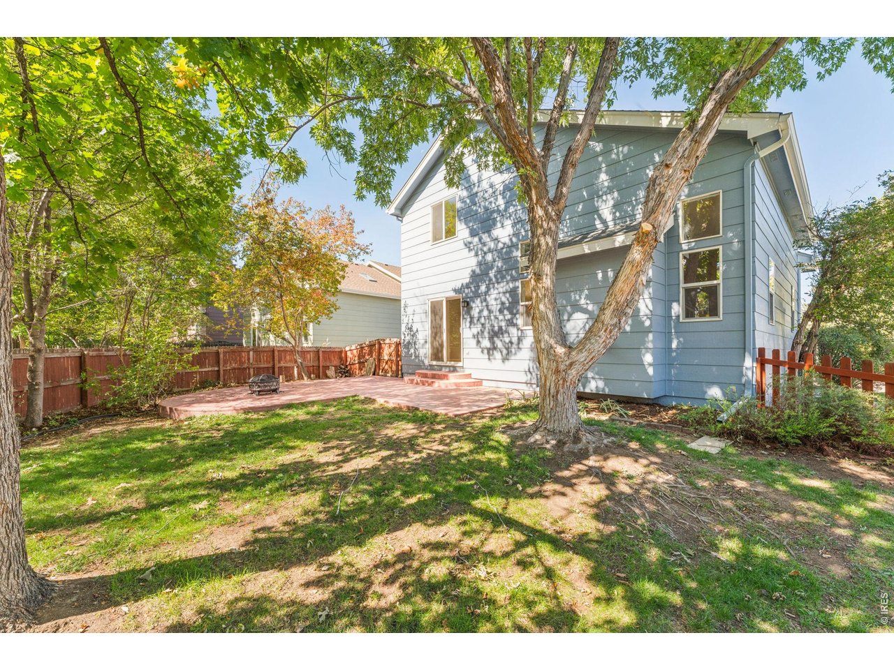 Property Photo 25 HUGE Stamped Concrete Patio and Large Backyard...