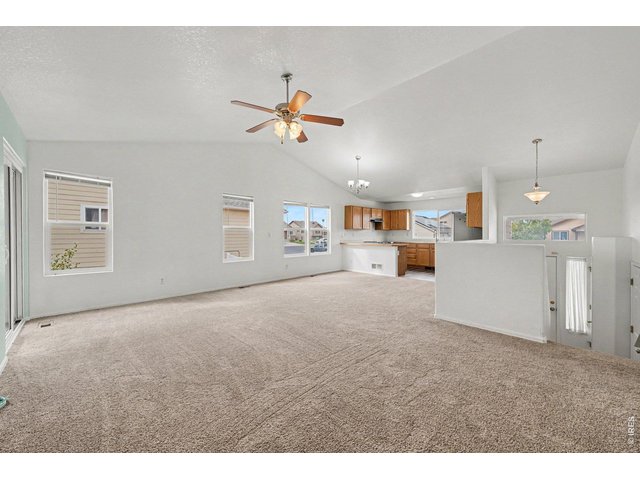 Property Photo 5 Living Room Open  to Kitchen and Dining