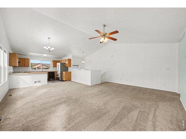 Property Photo 4 Open Living Room with Vaulted Ceilings
