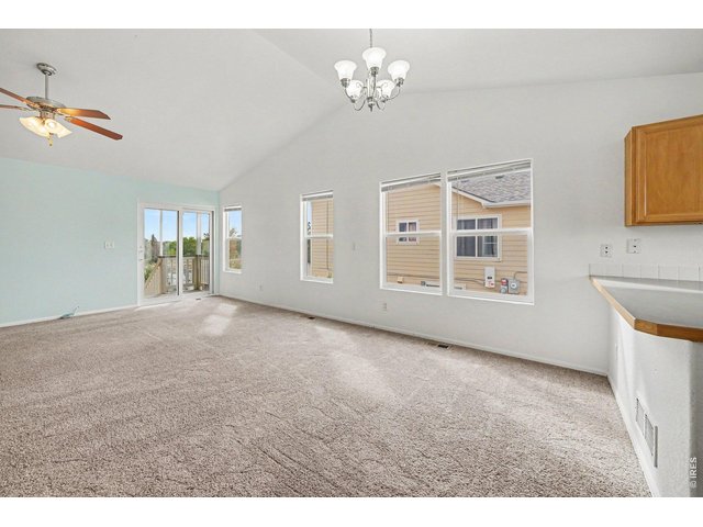 Property Photo 8 Living Space with Sliding Door to Backyard Patio