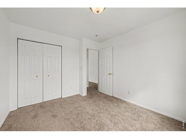 Property Photo 16 Large Guest Bedroom, Double-Door Closet, Neutral Carpet