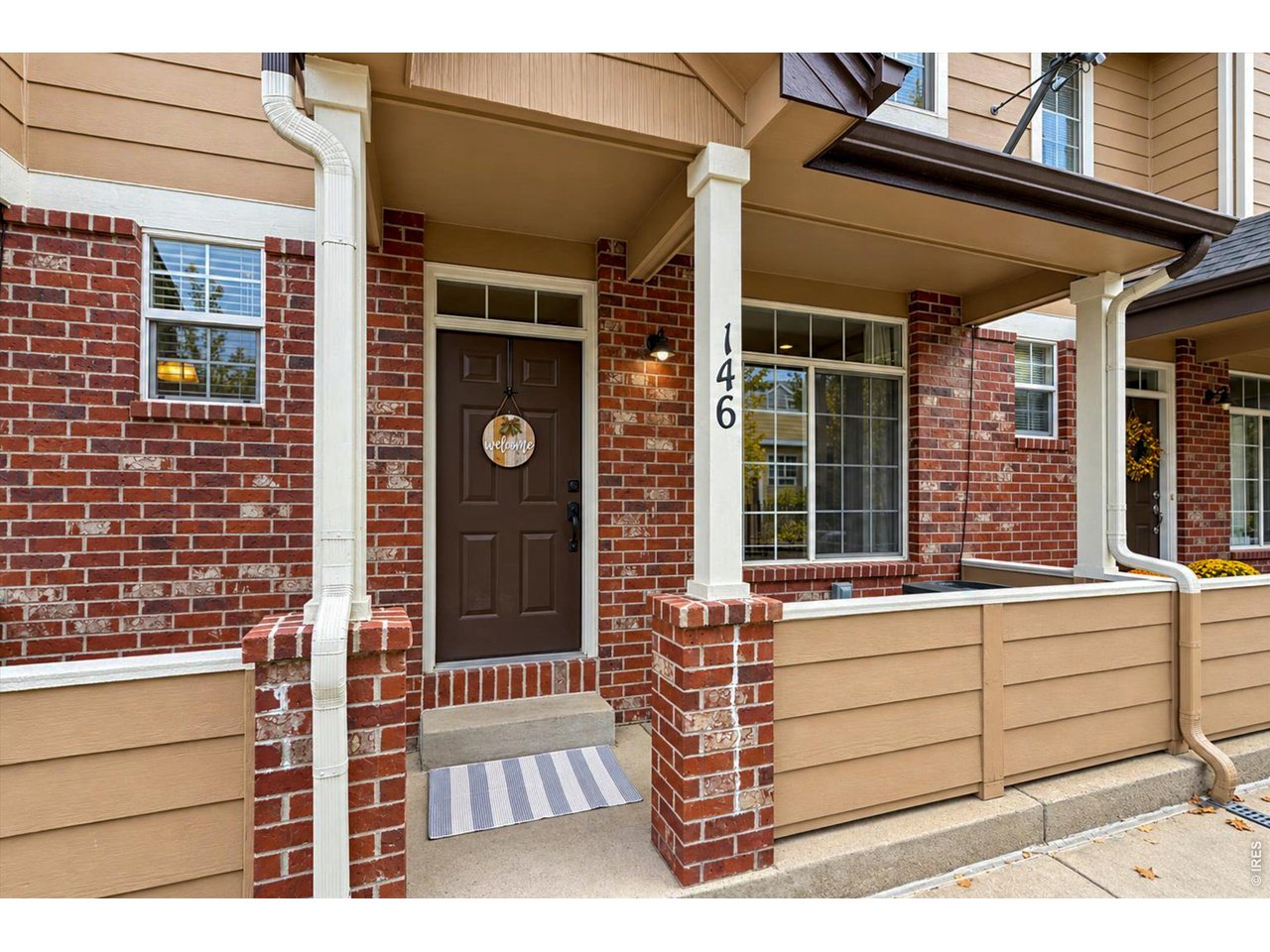 Property Photo 6 Welcoming covered front porch with room to sit