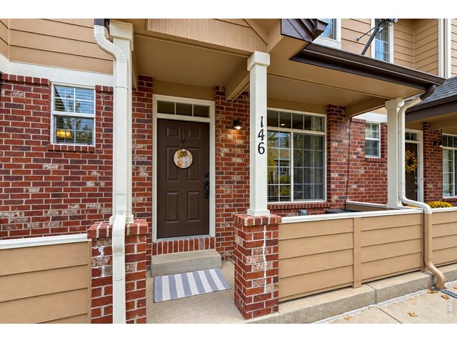 Property Photo 6 Welcoming covered front porch with room to sit