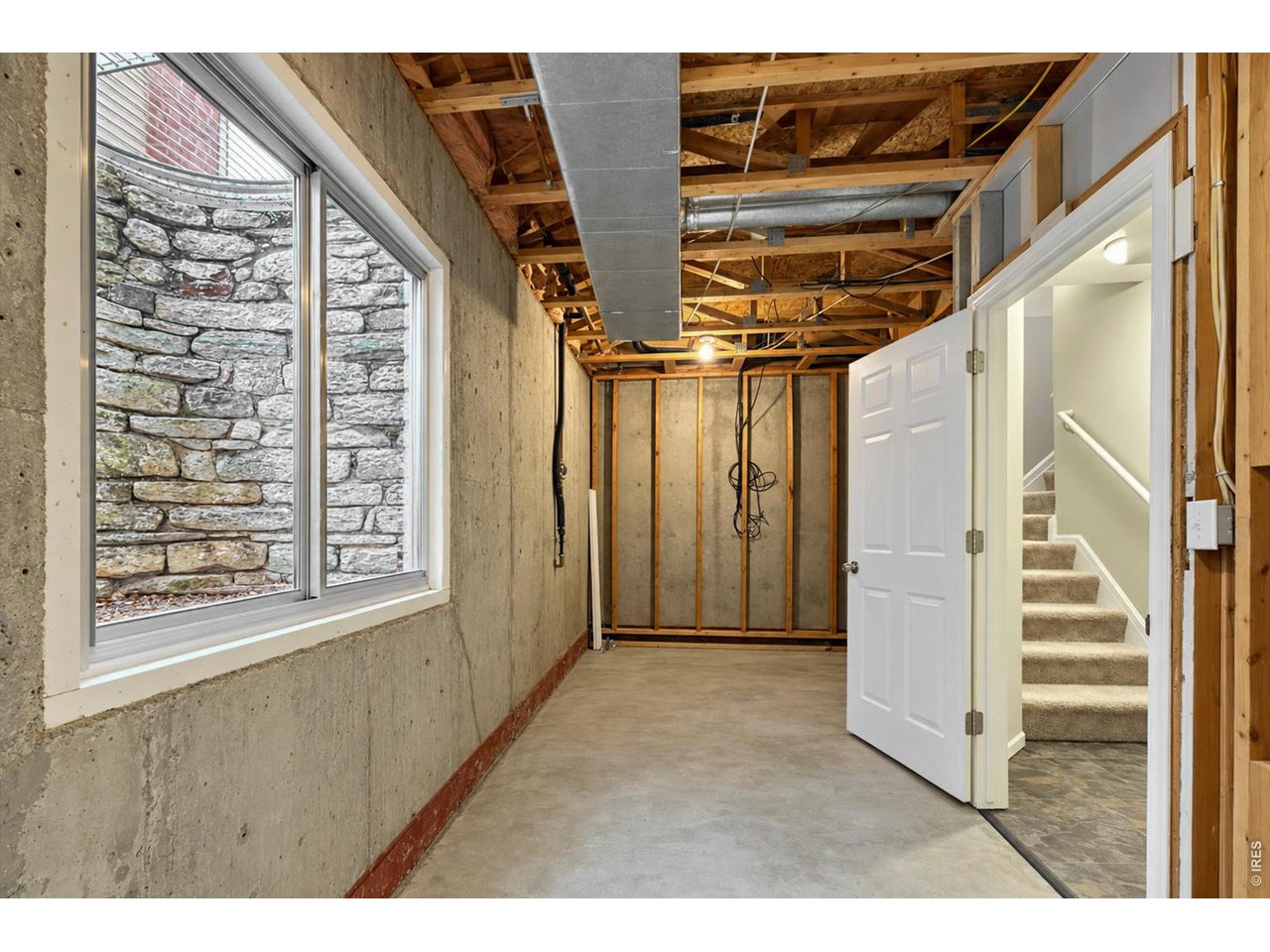 Property Photo 37 Basement and stairs from the garage