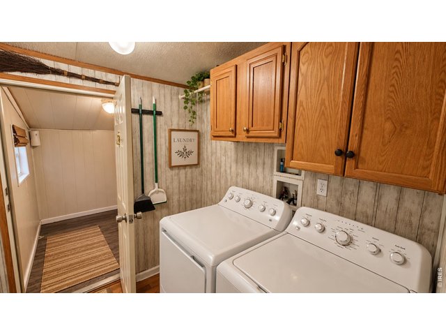 Property Photo 18 Laundry room and entry to attached garage/porch. Virtually staged