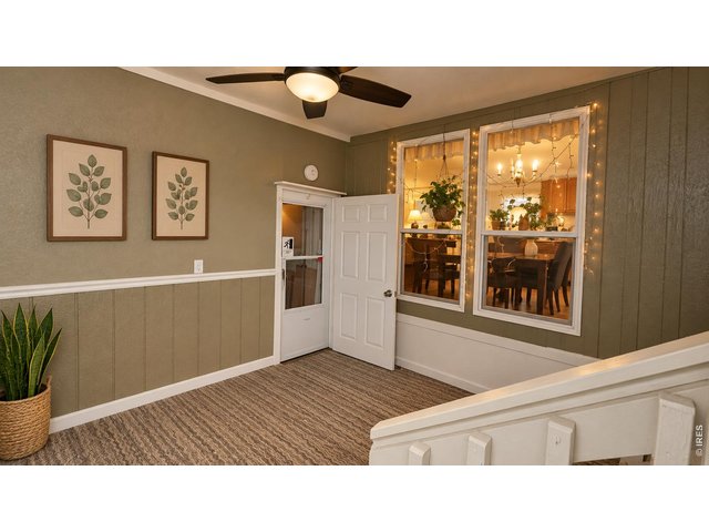 Property Photo 19 Virtually Staged Entry porch into garage and back yard