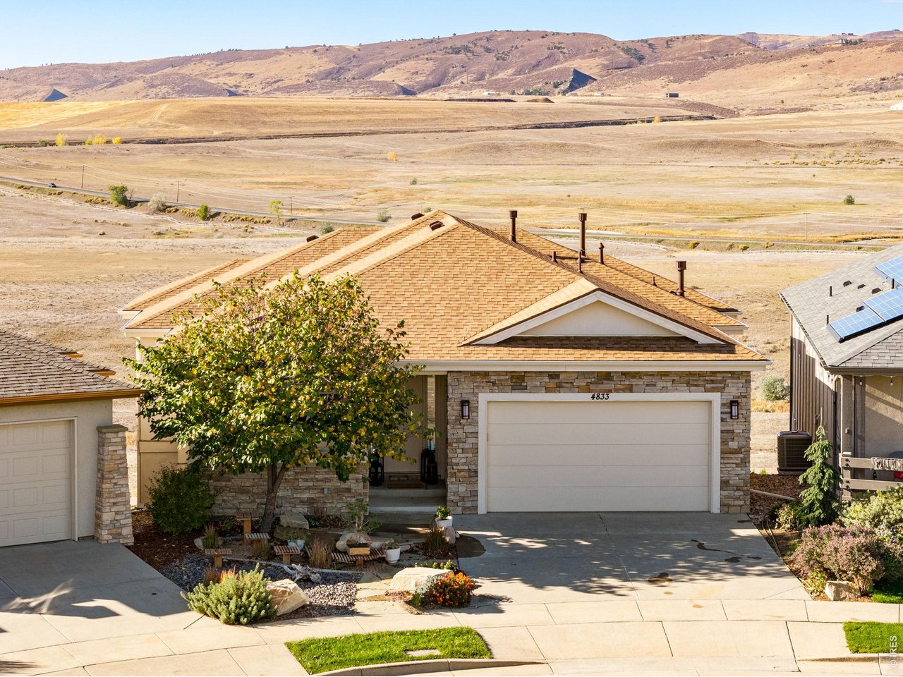 Property Photo 1 Exceptionally appointed this Custom Patio home, Backs to approx. 240 acres of Open Space, Heavenly Mountain/Foothills views for as far as you can see! Curated Modern Feel, New Class IV roof installed 2026, low maintenance, stucco and stone exterior.