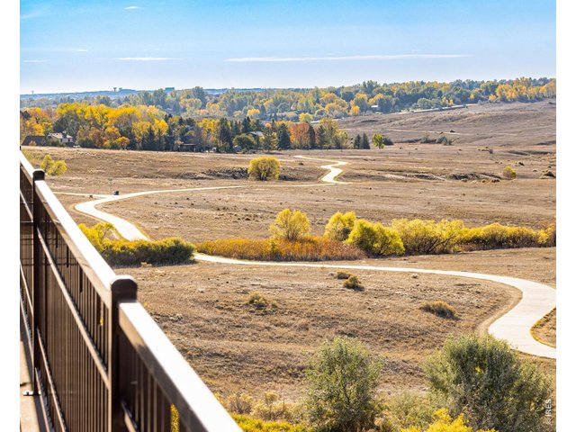 Property Photo 2 Views to the South - Nestled up against the Cathy Fromme Prairie and the Fossil Creek Trail, this one of kind location epitomizes peace + traquility!  4 covered decks off the back!
