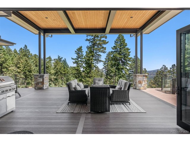 Property Photo 8 The overall ambiance is one of tranquility and luxury, seamlessly blending indoor elegance with the breathtaking beauty of the mountain landscape