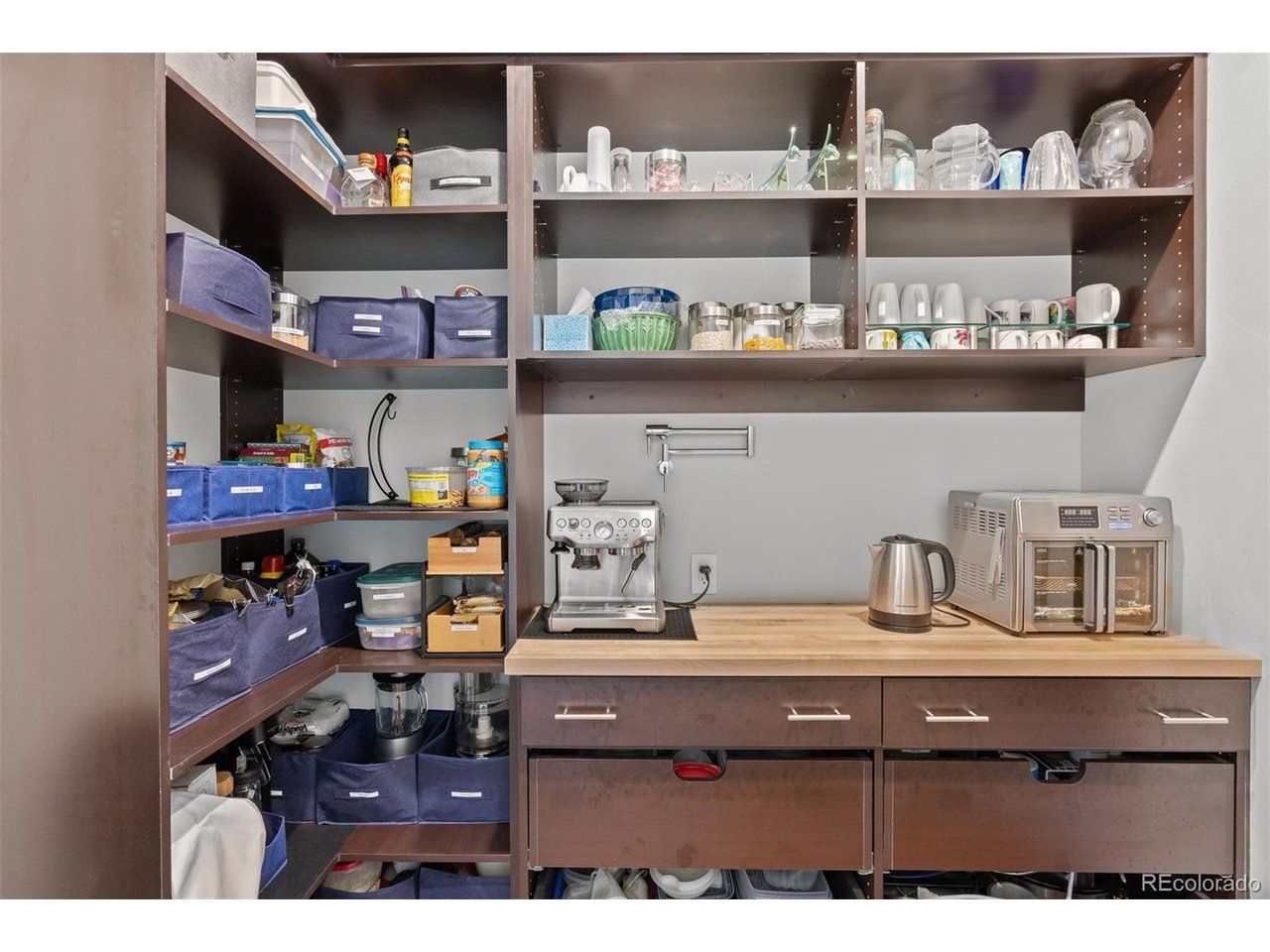 A large walk-in pantry offers exceptional storage and everyday convenience