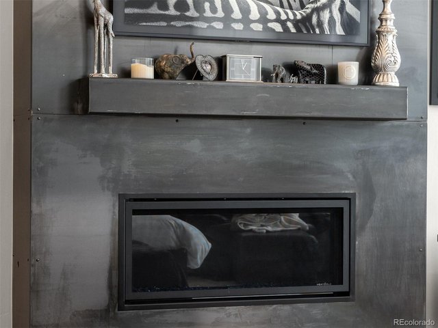 Property Photo 22 A fireplace in the primary bedroom adds comfort and a private retreat feel