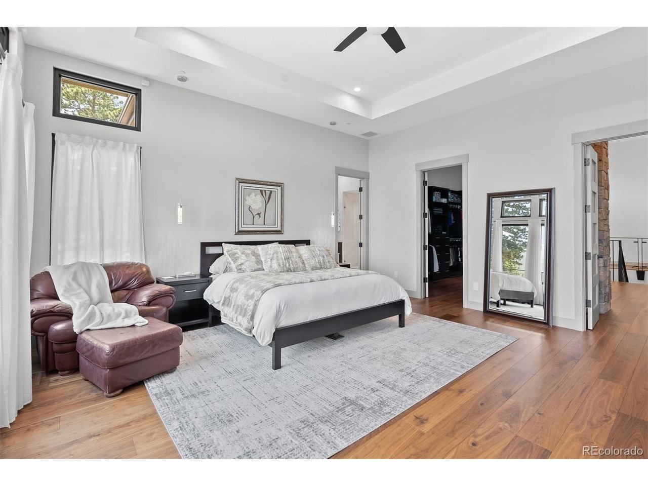 A spacious primary bedroom offers a peaceful sanctuary
