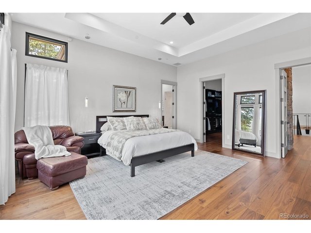 Property Photo 23 A spacious primary bedroom offers a peaceful sanctuary