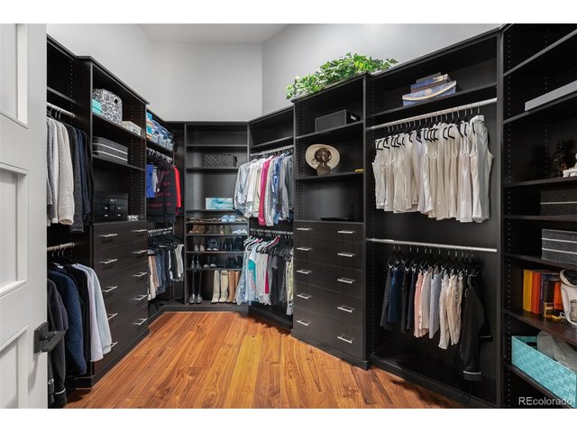 Property Photo 24 This walk-in closet isn't just a storage area; it's a personal sanctuary that elevates daily routines into a luxurious experience