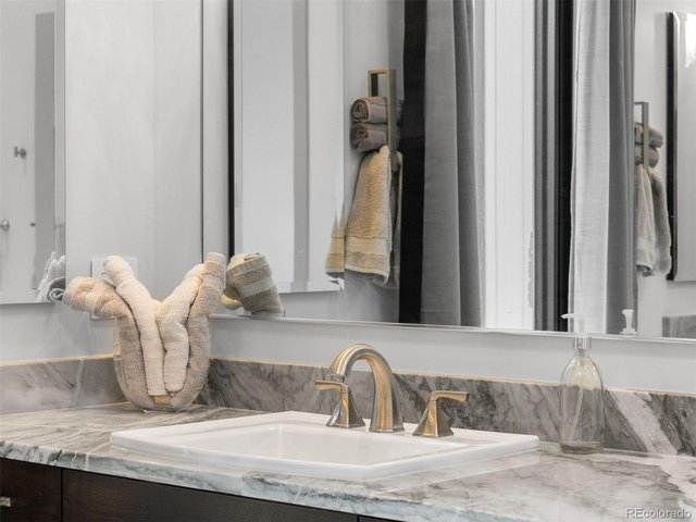 Property Photo 26 The primary bathroom is stunning, featuring modern finishes, a spa-like atmosphere, and thoughtful details throughout