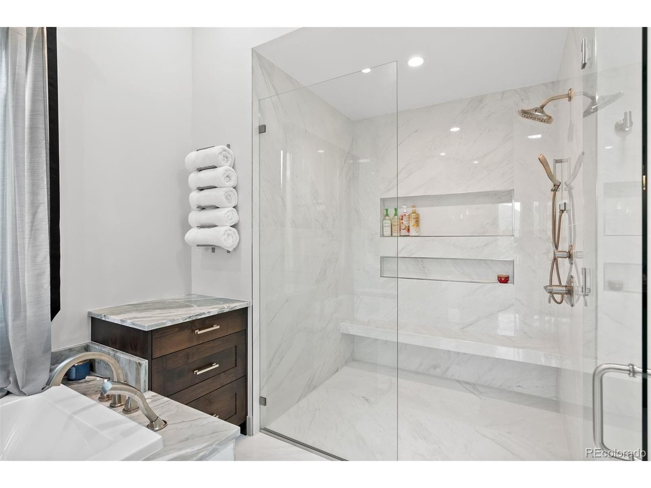 High ceilings and large windows that invite natural light, creating a bright and airy atmosphere
