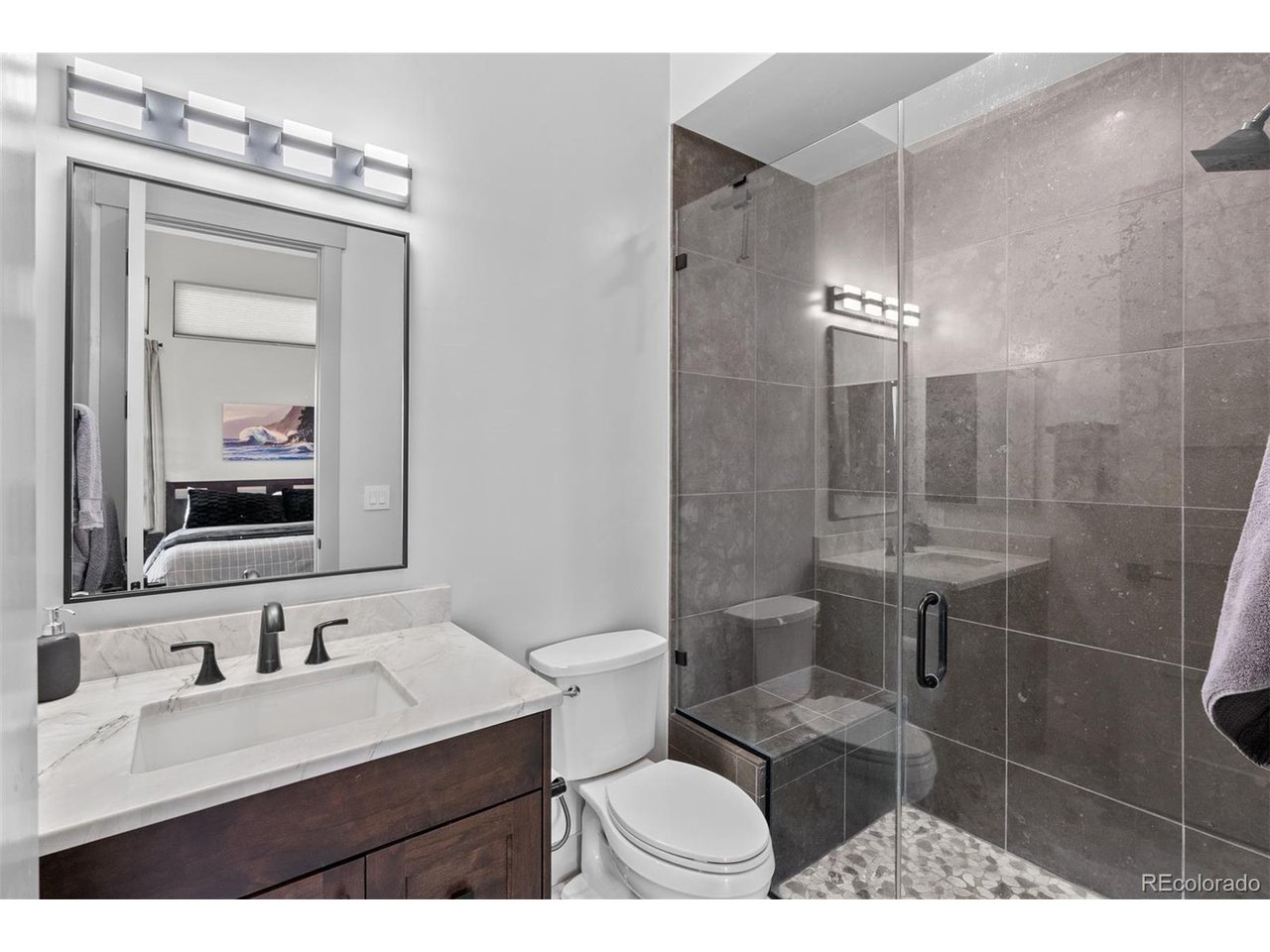 This bathroom features a spacious walk-in shower