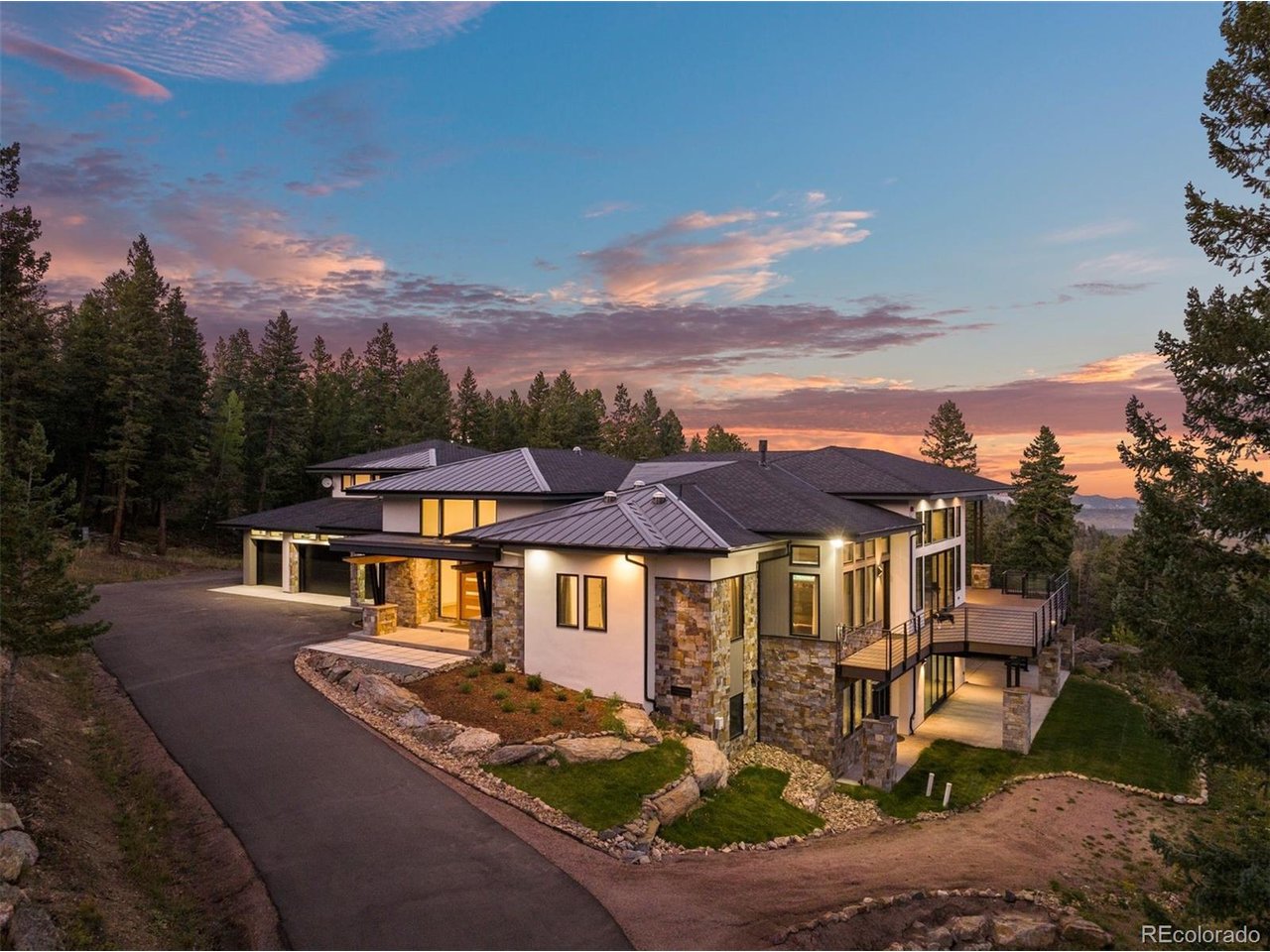 Tucked away in a secluded setting, this exceptional home is surrounded by breathtaking mountain views and serene natural beauty