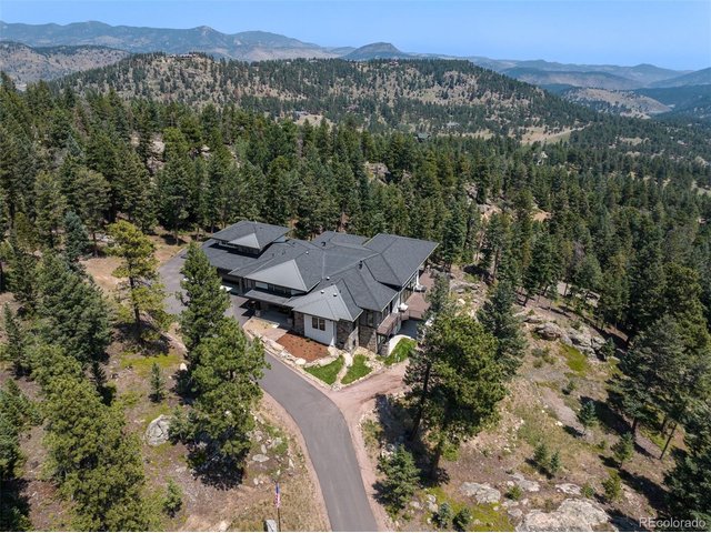 Property Photo 50 Nestled in a secluded setting, the home is surrounded by forest, providing privacy and a tranquil natural backdrop