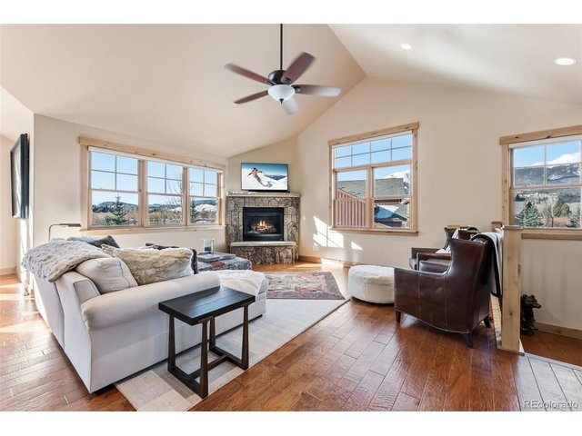 Property Photo 9 Gas fireplace, ample space, and big views on the main floor.