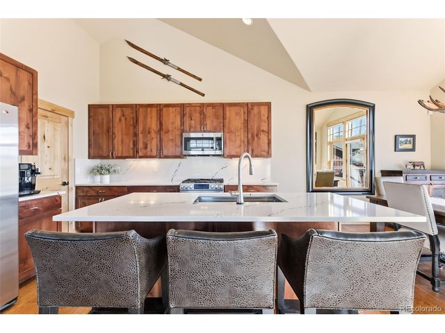 Property Photo 11 Lots of counter and cabinet space in a flexible kitchen layout.
